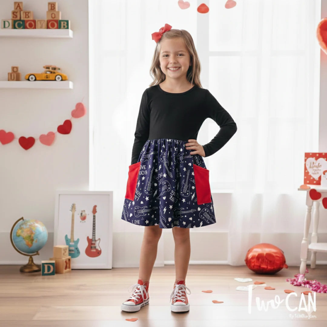 Girl wearing black Love Rocks dress
