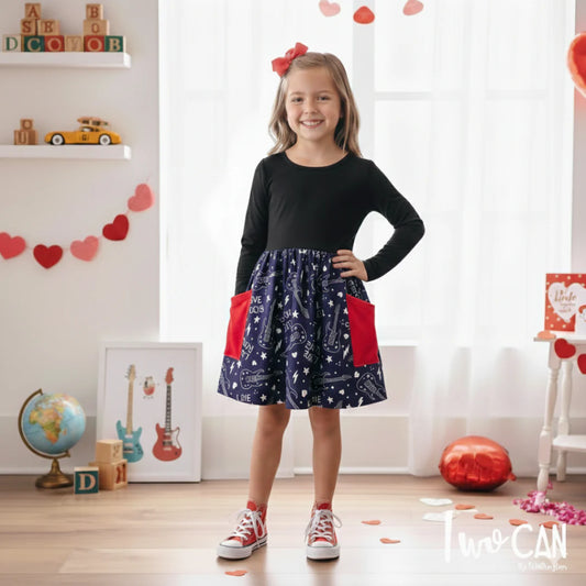 Girl wearing black Love Rocks dress